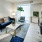living area with sofa, coffee table, floor to ceiling window, and view of bedroom at j sol luxury arlington apartments 