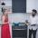 friends chatting in kitchen with stainless steel appliances and ceramic tile backsplash at j sol luxury arlington apartments