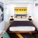 Bedroom with bed, night stands, and modern artwork at j sol luxury arlington apartments