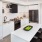 Kitchen With Stainless Steel Appliances, White Cabinetry And White Backsplash At J Sol Apartments In Arlington, VA