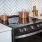 Stainless Steel Stove And White Tile Backsplash At J Sol Apartments In Arlington, VA