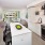 Kitchen With White Cabinetry, White Backsplash And View Of Living Area At J Sol Apartments In Arlington, VA
