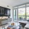 living area with sofa, side tables, coffee table, floor to ceiling window and modern artwork at j sol