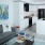 living area with sofa, side tables, coffee table, view of kitchen and modern artwork at j sol