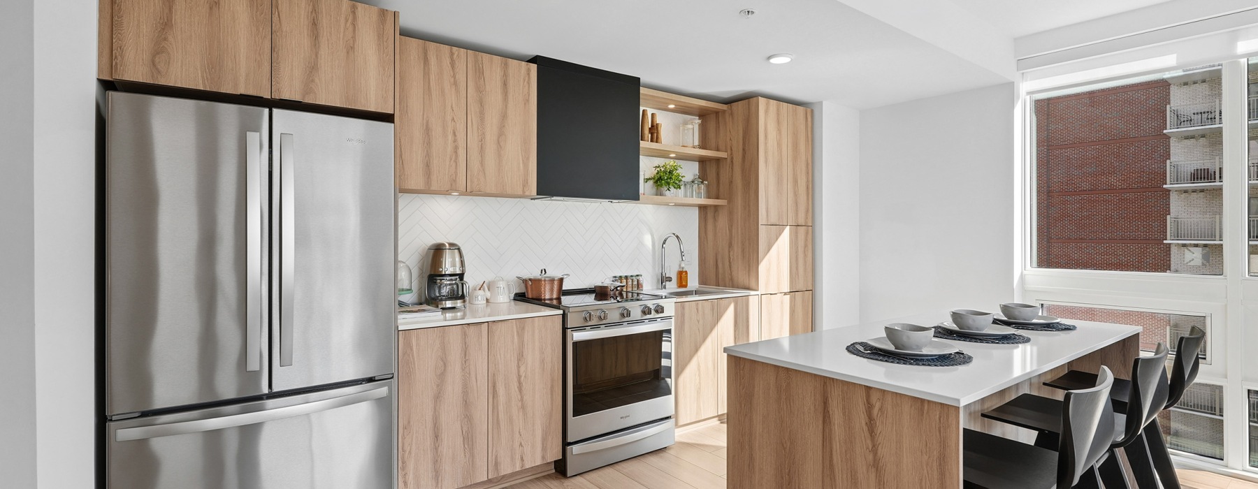 Kitchen with stainless appliances and island At J Sol Apartments In Arlington, VA