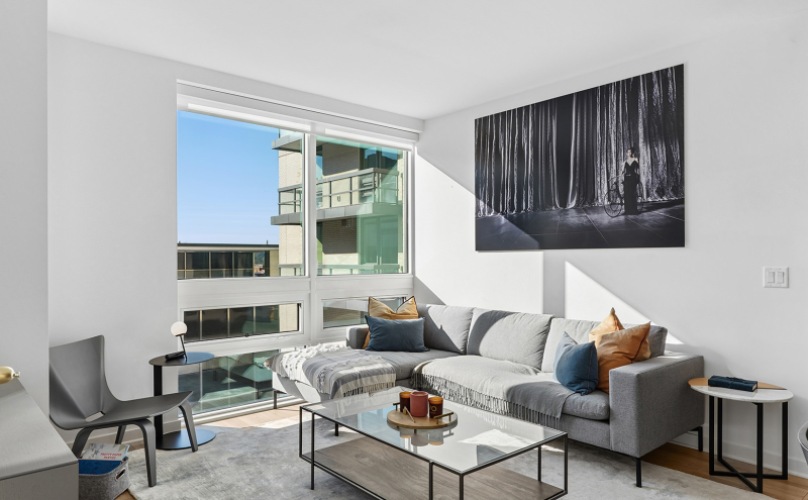 Living Area With Sofa And Coffee Table At J Sol Apartments In Arlington, VA